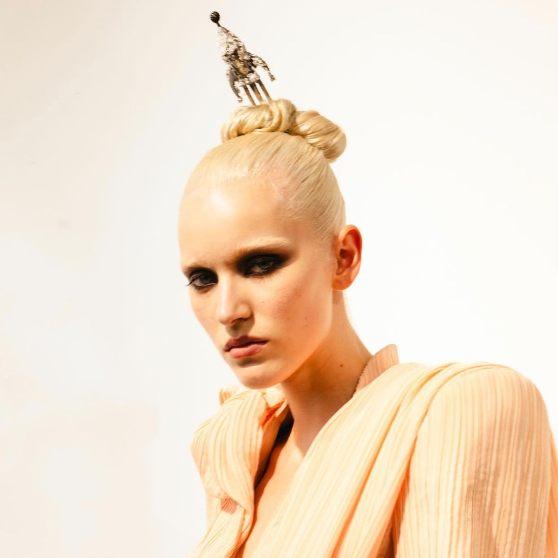 Sleek couture bun, hair by Kuro